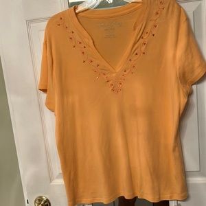 Faded Glory orange with rhinestones and threaded designs around stones.